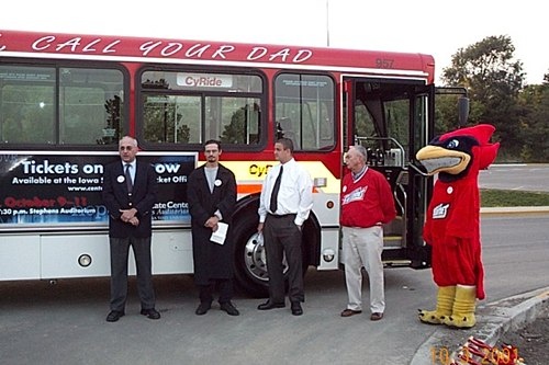 957 with staff and mascot